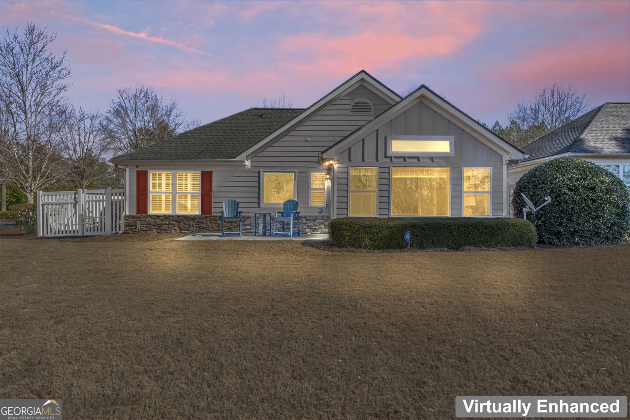100 Cottage Club Drive Locust Grove, GA 30248 - Photo 34 of 42 a view of a house with a yard and potted plants