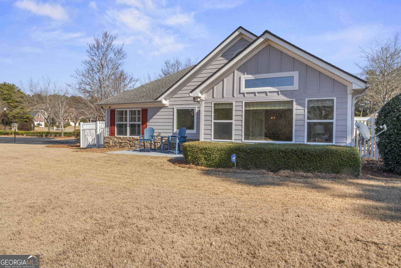 100 Cottage Club Drive Locust Grove, GA 30248 - Photo 35 of 42 a front view of a house with a yard