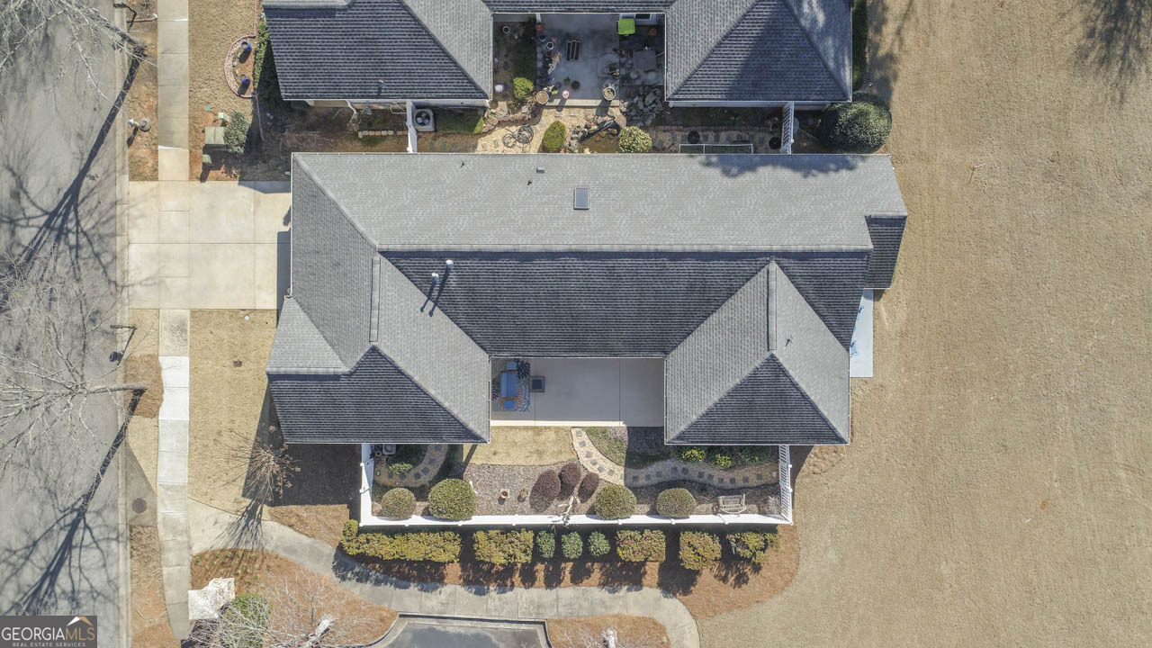 100 Cottage Club Drive Locust Grove, GA 30248 - Photo 37 of 42 an aerial view of a house with wooden balcony