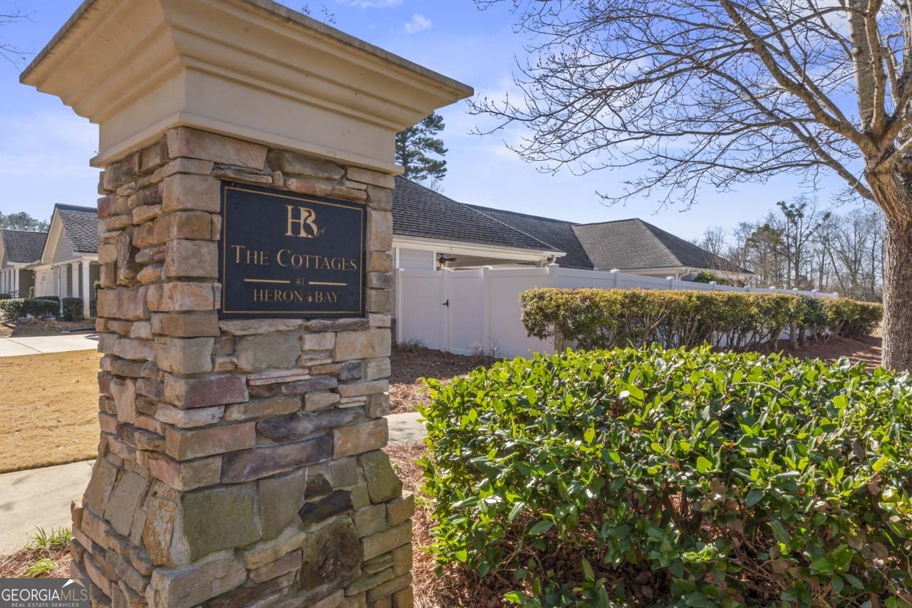 100 Cottage Club Drive Locust Grove, GA 30248 - Photo 39 of 42 a front view of a house with a yard