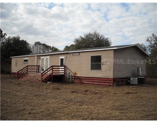 6924 South Fork Ranch Road Clermont, FL 34714 - Photo 1 of 1 a backyard of a house
