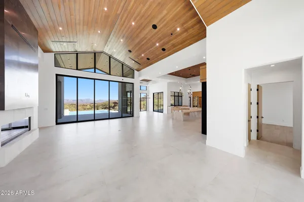a view of an empty room with a fireplace