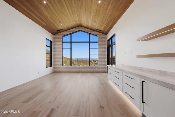 a kitchen with cabinets and washer