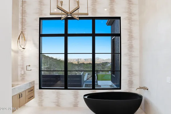 a lobby with furniture and a floor to ceiling window