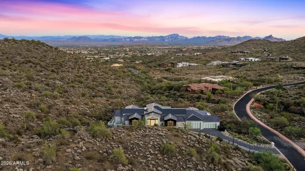 a aerial view of a house with a yard