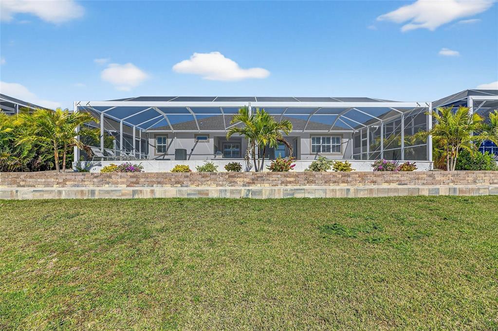 994 Signet Drive Apollo Beach, FL 33572 - Photo 66 of 98 a view of a house with a backyard and a garden