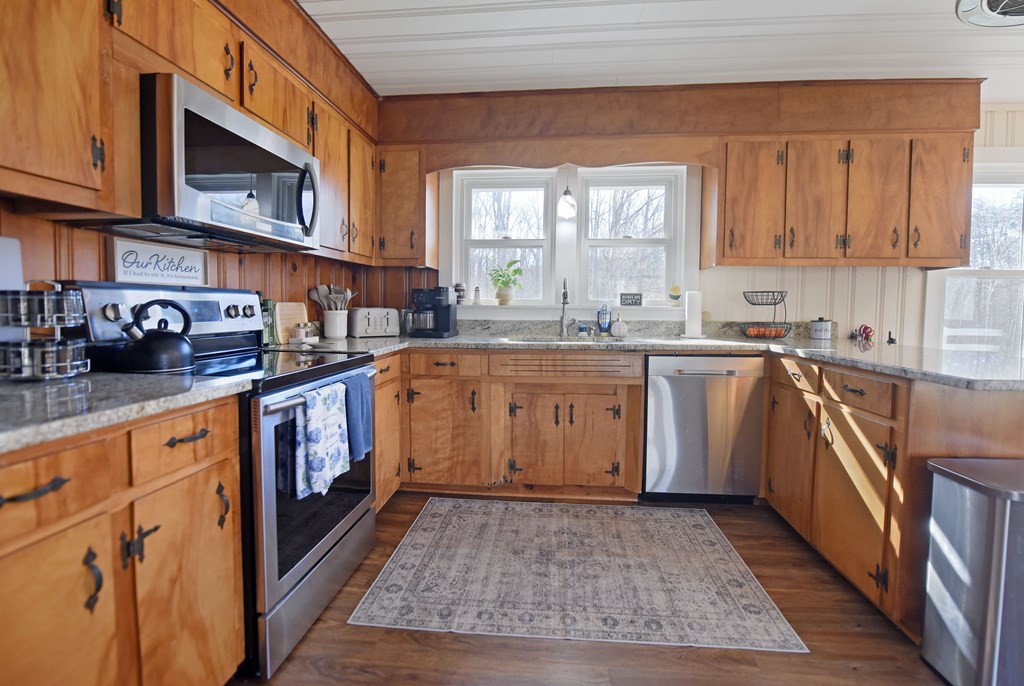16894 Morganton Highway Morganton, GA 30560 - Photo 15 of 51 a kitchen with a sink stove and cabinets