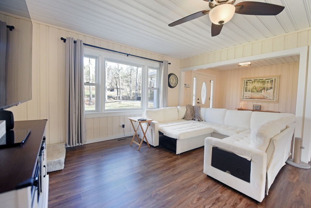 16894 Morganton Highway Morganton, GA 30560 - Photo 21 of 51 a living room with couches and a flat screen tv with wooden floor