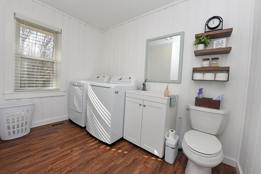 16894 Morganton Highway Morganton, GA 30560 - Photo 28 of 51 a bathroom with a toilet a sink and a window