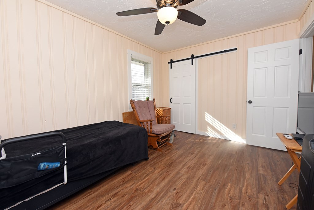 16894 Morganton Highway Morganton, GA 30560 - Photo 29 of 51 a living room with a bed furniture and a flat screen tv