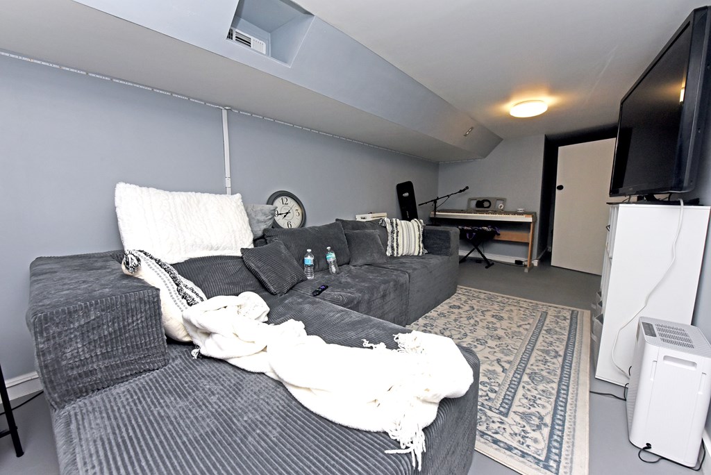 16894 Morganton Highway Morganton, GA 30560 - Photo 32 of 51 a living room with furniture a flat screen tv and kitchen view