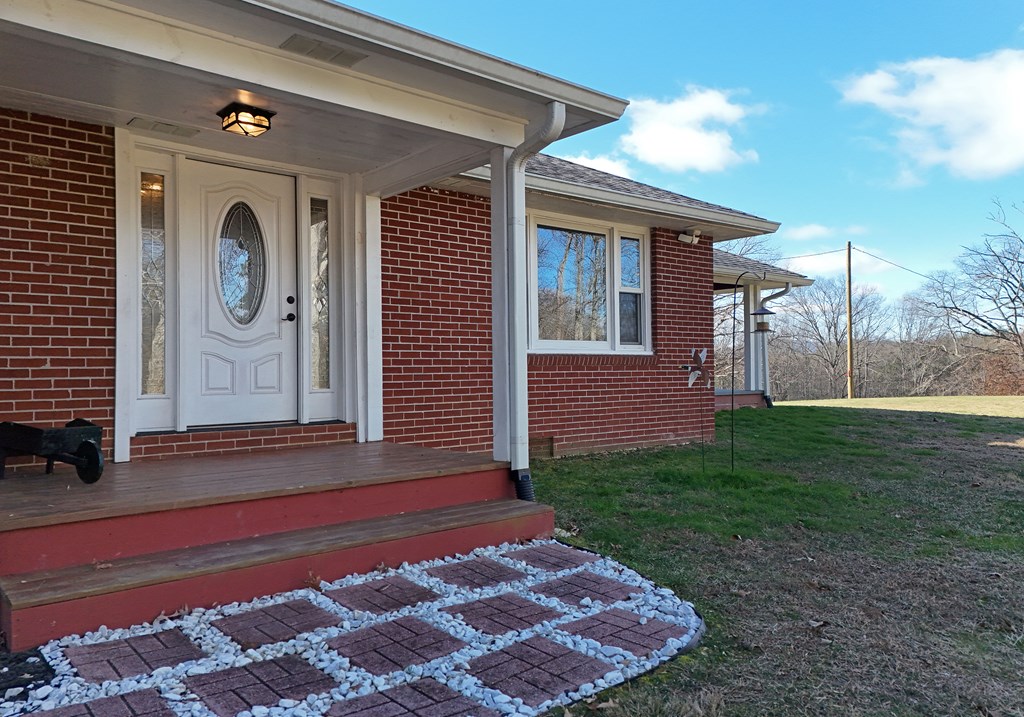 16894 Morganton Highway Morganton, GA 30560 - Photo 39 of 51 a front view of a house with garden