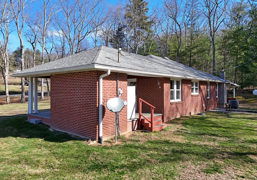 16894 Morganton Highway Morganton, GA 30560 - Photo 44 of 51 a front view of a house with garden