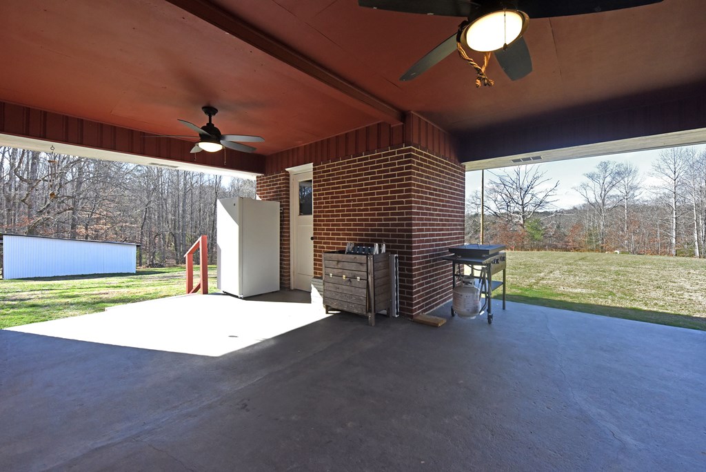 16894 Morganton Highway Morganton, GA 30560 - Photo 45 of 51 a view of an empty room with a fireplace and a large window