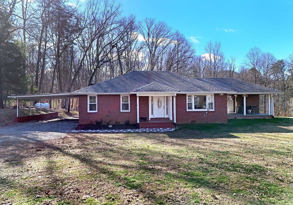 16894 Morganton Highway Morganton, GA 30560 - Photo 6 of 51 a view of a yard in front of a house with large trees