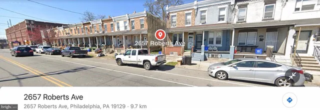 a view of a cars park in front of a building