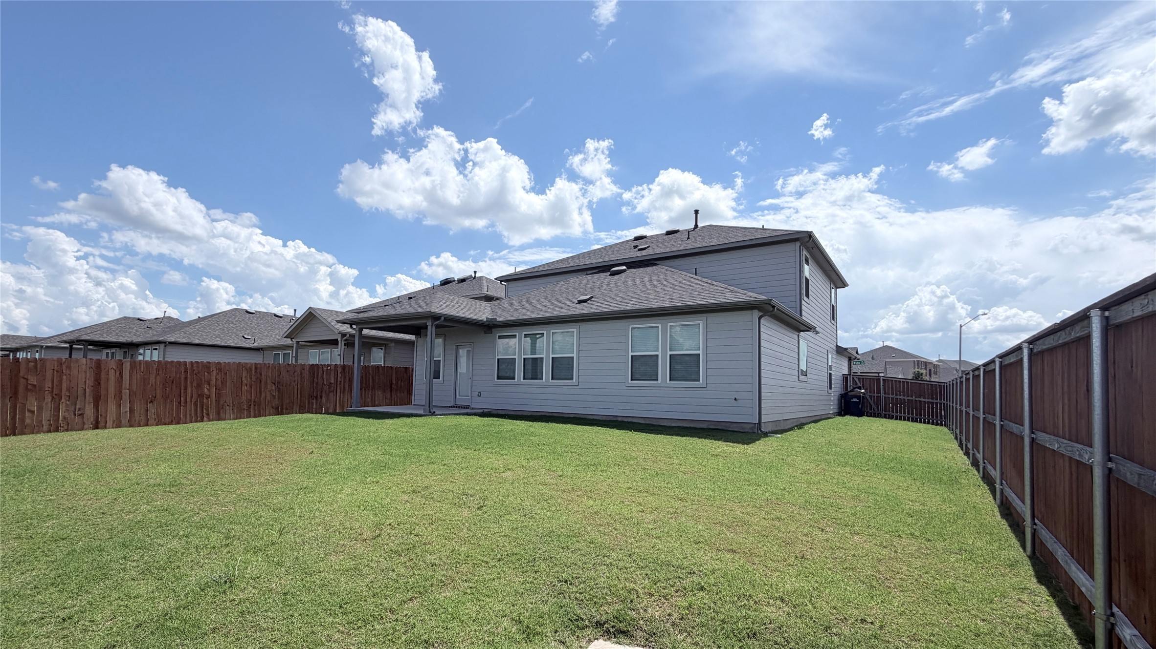 2001 Wynn Road Hutto, TX 78634 - Photo 37 of 39 A spacious, enclosed backyard offers ample green space and a private setting.