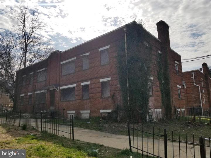 4639 Hillside Road Southeast Washington, DC 20019 - Photo 4 of 13 a tall building that has a tree in front of it