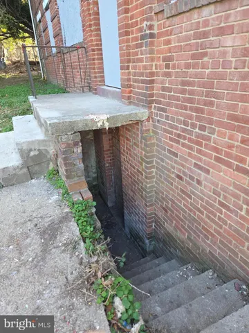 a brick building with a yard