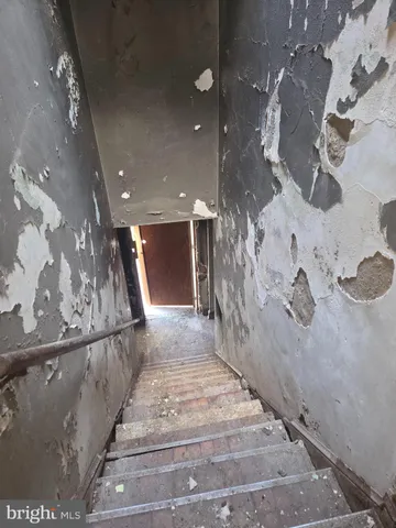 a view of a hallway with stairs