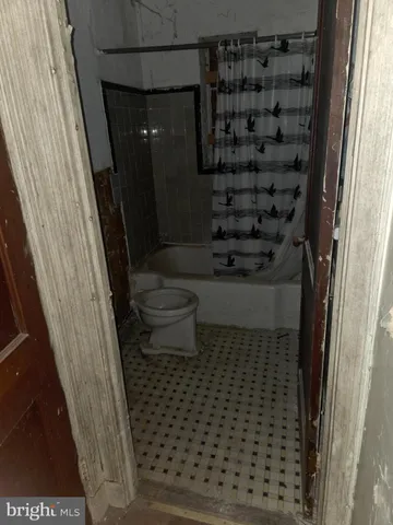 a bathroom with a granite countertop sink
