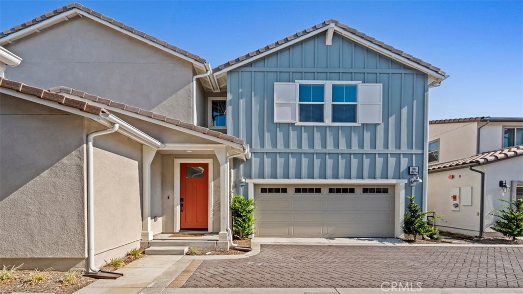 7044 Mallow Drive Mall, Unit 4 Fontana, CA 92336 - Photo 2 of 19 a front view of a house with a yard