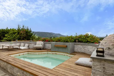 a view of a chairs and table in the patio