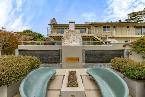 a view of a patio with furniture