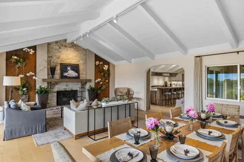 a kitchen with stainless steel appliances kitchen island granite countertop a refrigerator and cabinets