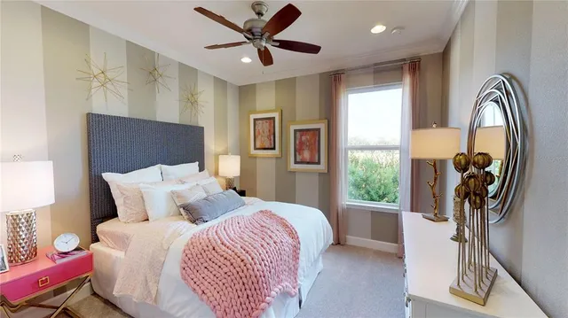 a bedroom with a bed and a large window