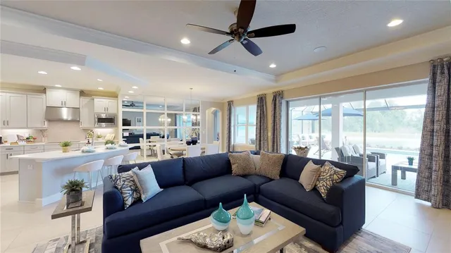 a view of a living room kitchen and a large window