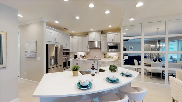 a kitchen with refrigerator and cabinets
