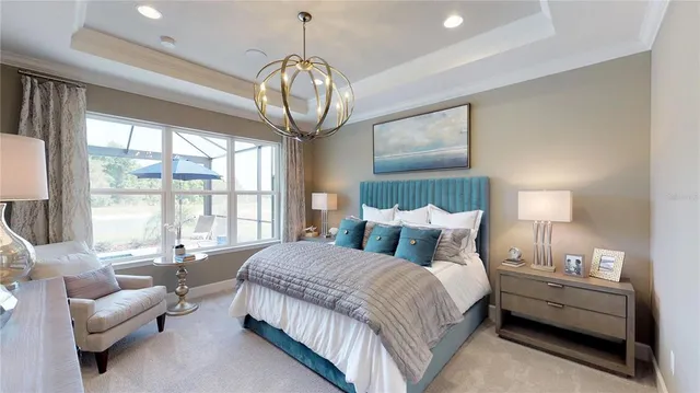 a bedroom with bed and a chandelier