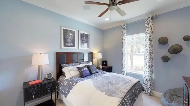 a bed room with a bed and a window