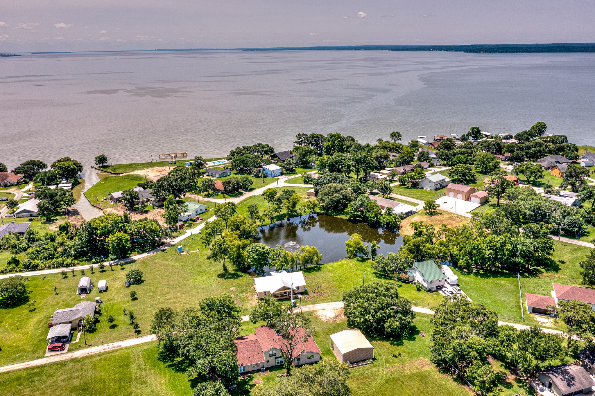 20 Clearview Point Blank, TX 77364 - Photo 37 of 37 Nestled by a serene lakeside, this charming neighborhood offers picturesque water views and lush greenery, perfect for a tranquil lifestyle.