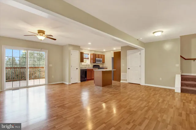 a view of a kitchen with a sink and a window