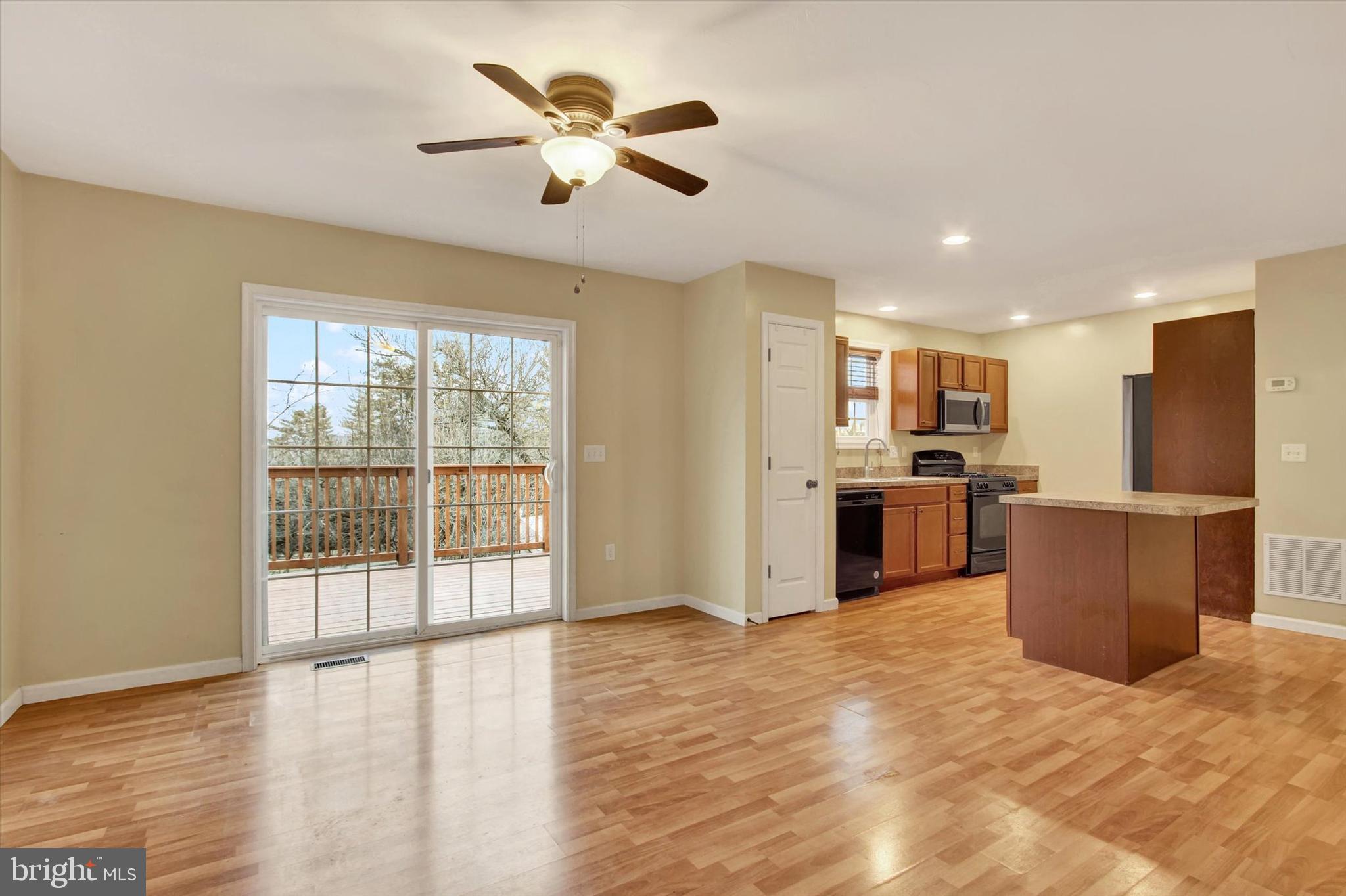 58 Skyview Circle Hanover, PA 17331 - Photo 7 of 31 a view of kitchen with stainless steel appliances kitchen island wooden floor and window
