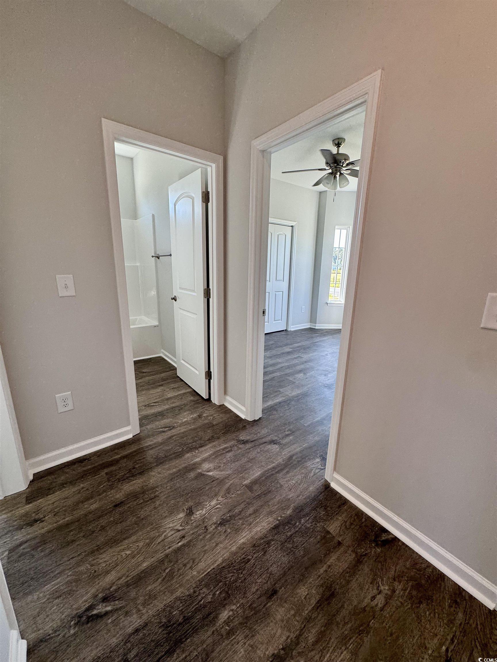 594 Shallow Cv Drive Conway, SC 29527 - Photo 12 of 29 Hall with dark wood-style floors and baseboards