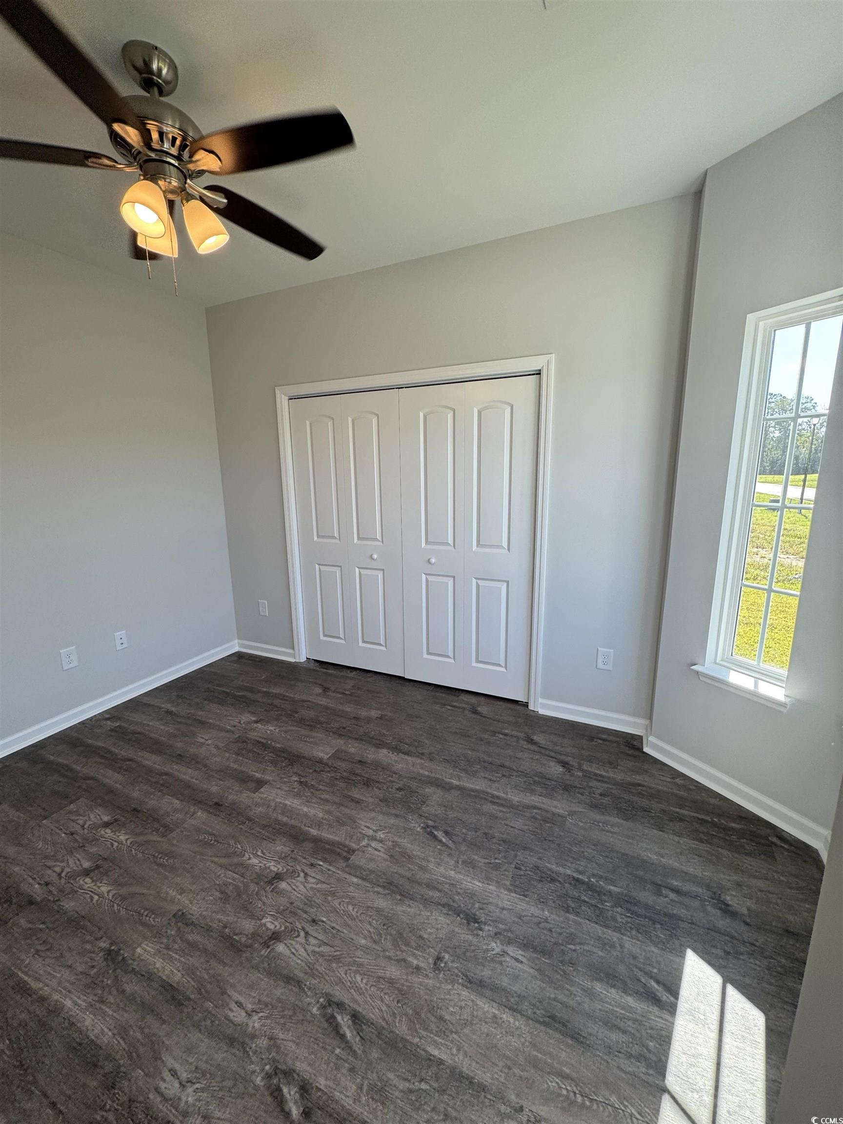 594 Shallow Cv Drive Conway, SC 29527 - Photo 16 of 29 Unfurnished bedroom featuring dark wood-style floo