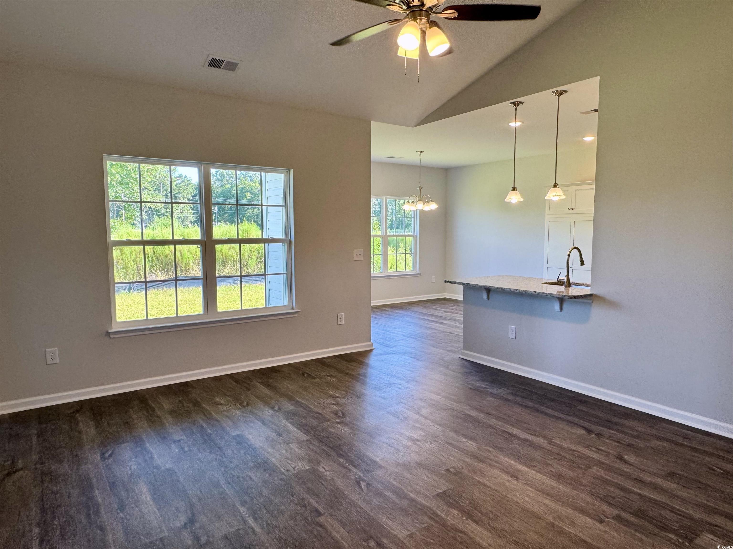 594 Shallow Cv Drive Conway, SC 29527 - Photo 25 of 29 Unfurnished living room featuring vaulted ceiling,