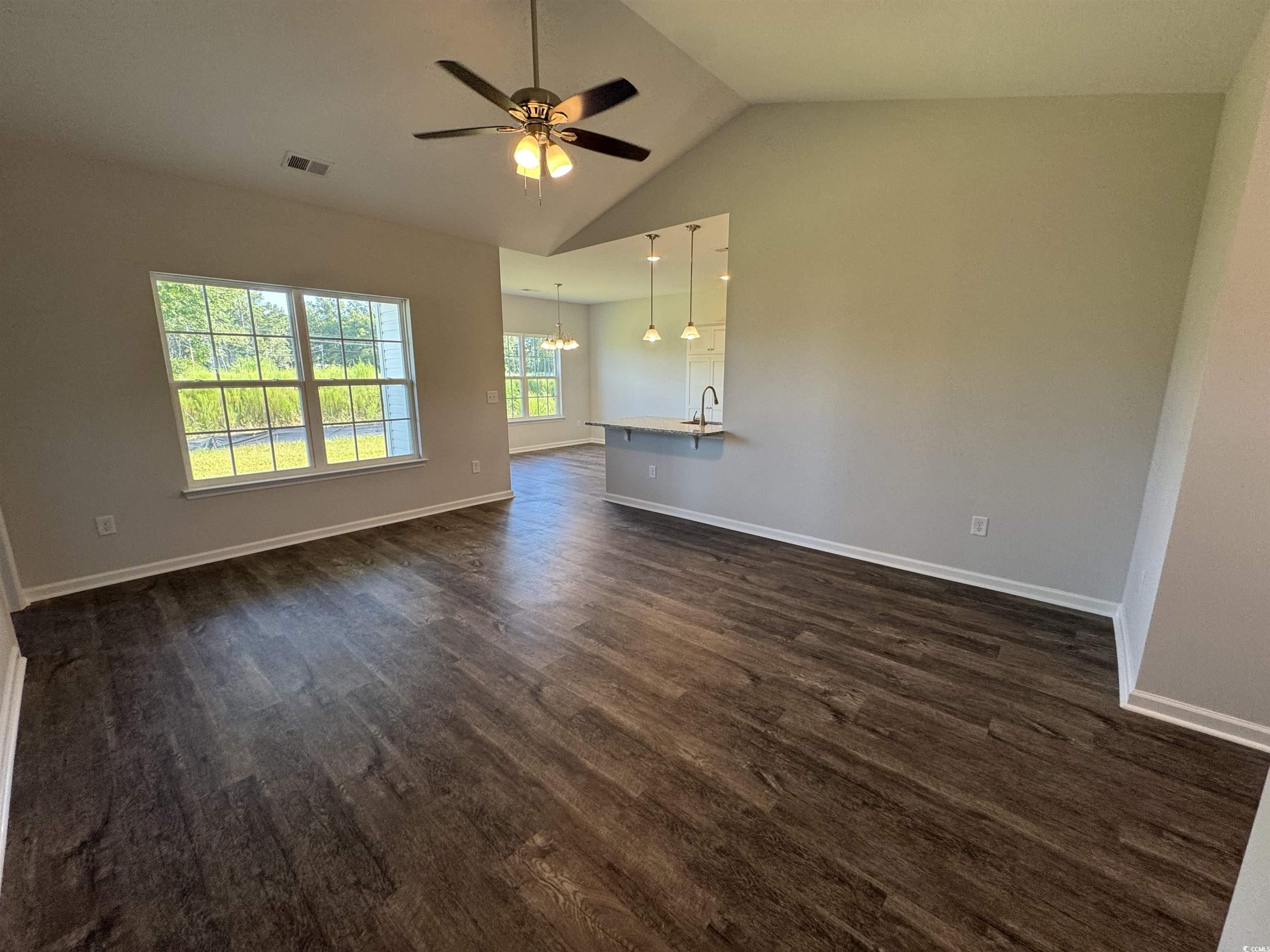 594 Shallow Cv Drive Conway, SC 29527 - Photo 26 of 29 Unfurnished living room featuring high vaulted cei