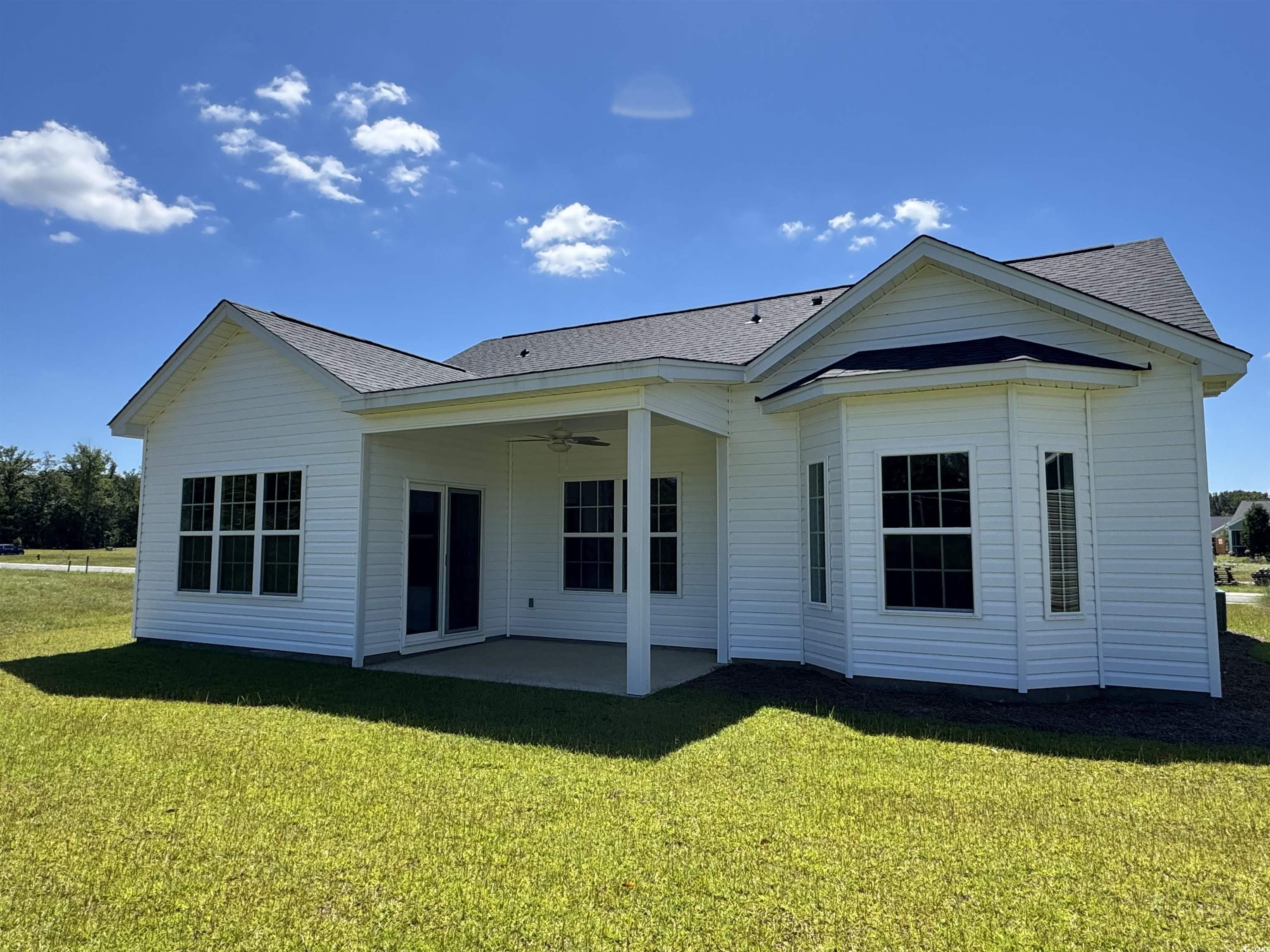 594 Shallow Cv Drive Conway, SC 29527 - Photo 3 of 29 Rear view of house with ceiling fan, a patio, a ya