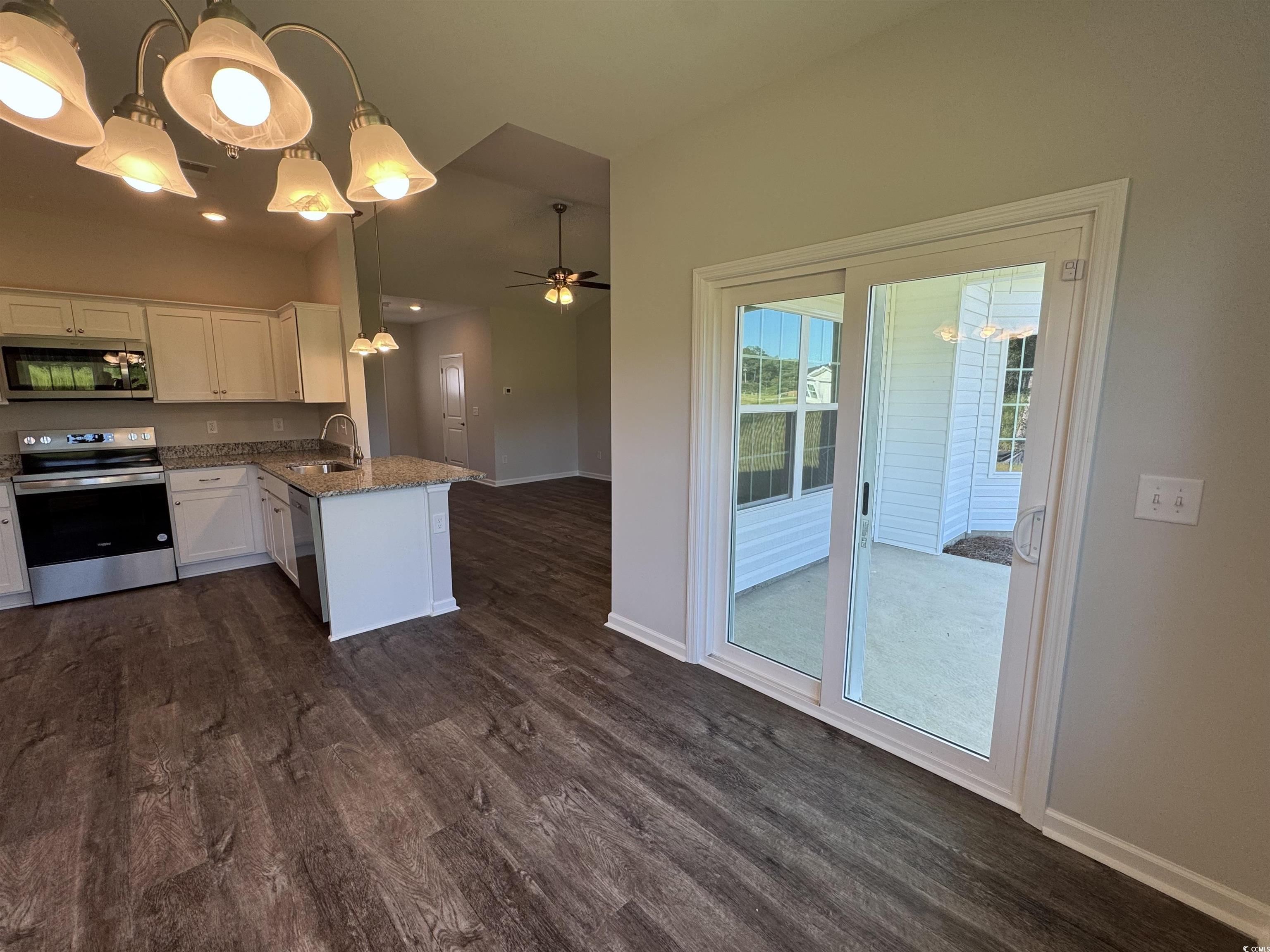 594 Shallow Cv Drive Conway, SC 29527 - Photo 8 of 29 Kitchen with white cabinetry, stainless steel appl