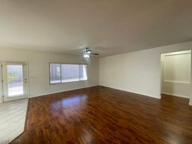 3047 Hickory Valley Road Henderson, NV 89052 - Photo 5 of 21 Rich hardwood floors extend through this open-concept living space with ample natural light.