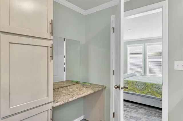 a view of room with window and wooden floor