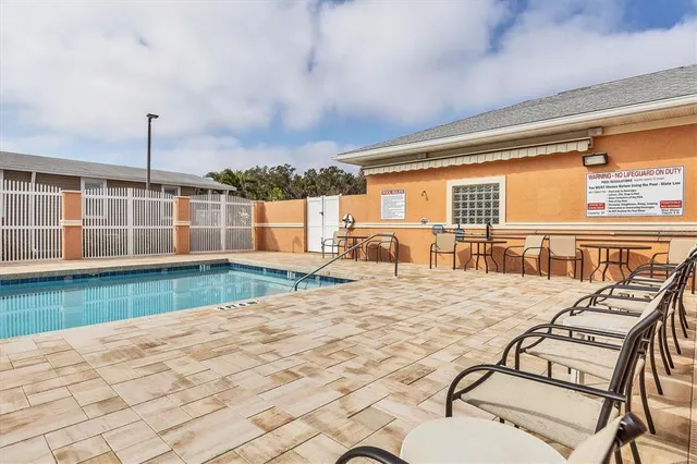a view of swimming pool with outdoor seating