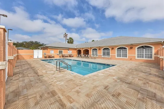 a view of swimming pool with a yard