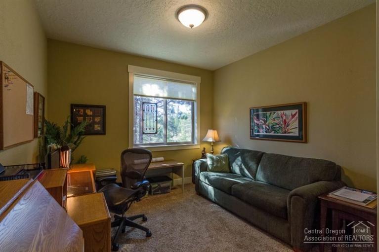 22 Oregon Loop Sunriver, OR 97707 - Photo 20 of 25 a living room with furniture and a flat screen tv