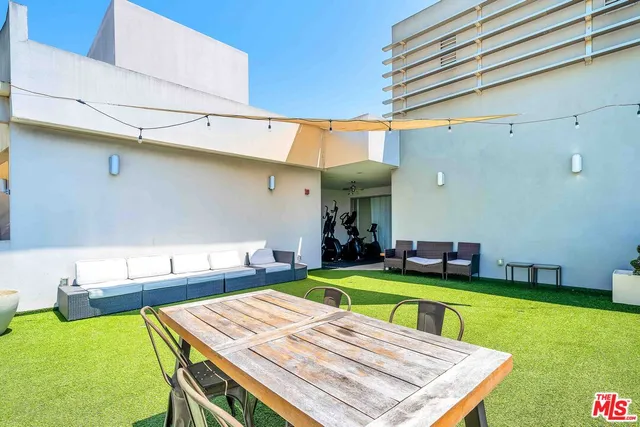 a view of a kitchen with a table and chairs