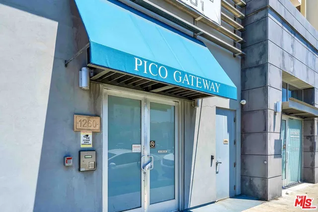 a front view of a building with parking